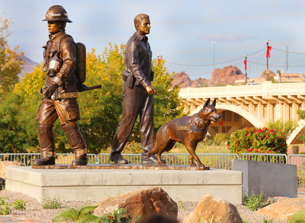 bronze statue of a fire fighter, police officer, and police canine