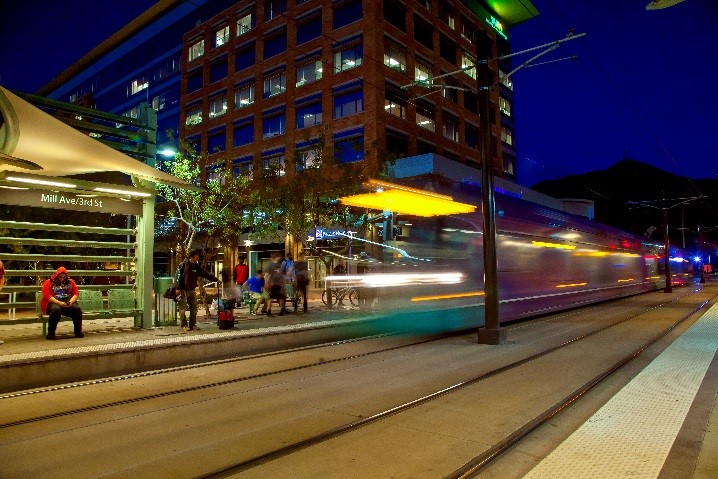 Light rail in motion on tracks