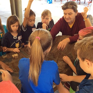 Teacher helping students learn water conservation