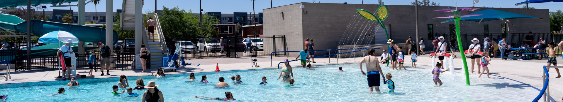 Overview photo of Clark Park Pool shallow end with guests in the water.