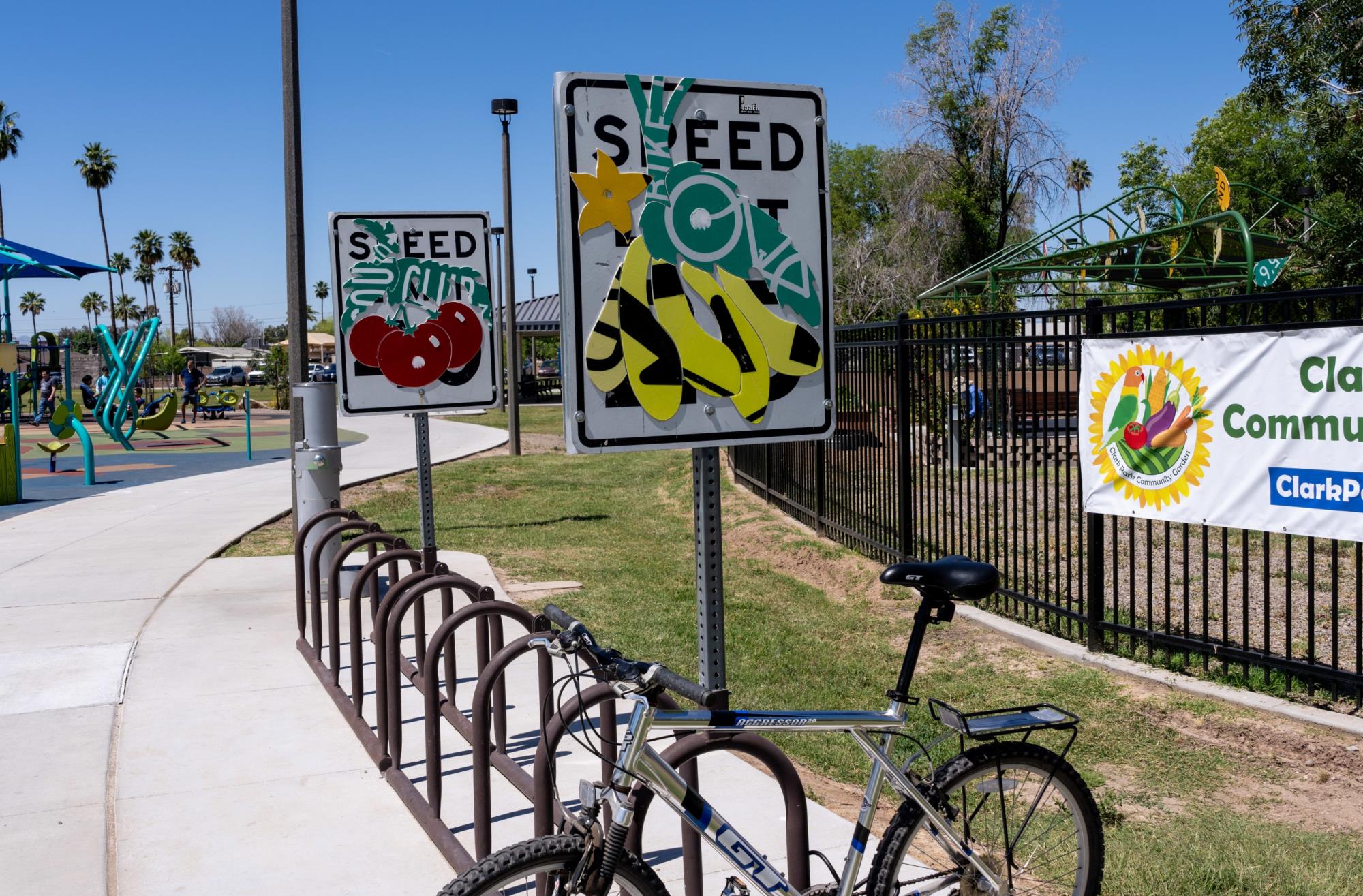 Image of bike racks with repurposed speed limit signs attached.