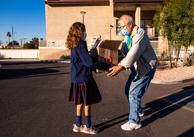 I-HELP-student delivering donations 740